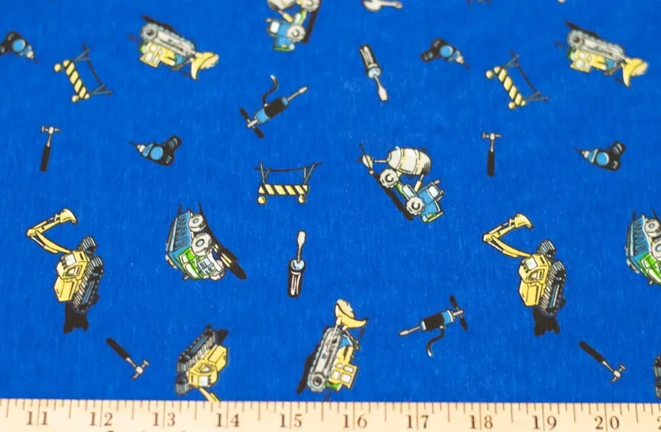 Cotton Stretch Knit Jersey Fabric, Construction Trucks on Blue, Soft feel and Nice Drape. 2-way stretch.  Sold by the 1/2 yard