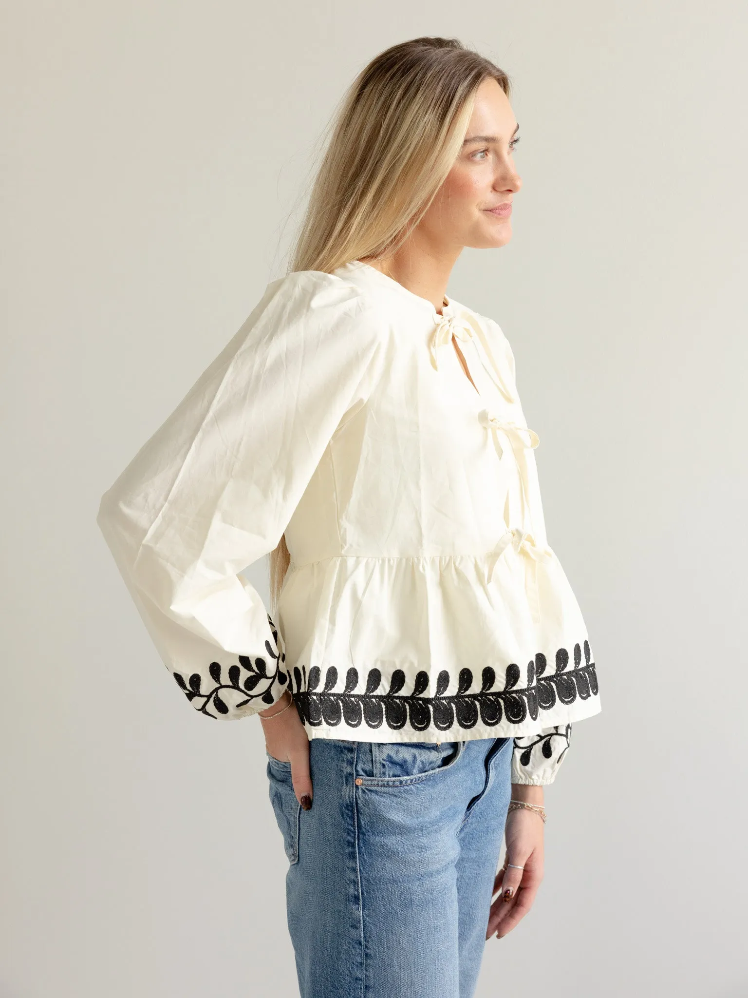 Full Coverage Fit Embroidered Peplum Bow Blouse