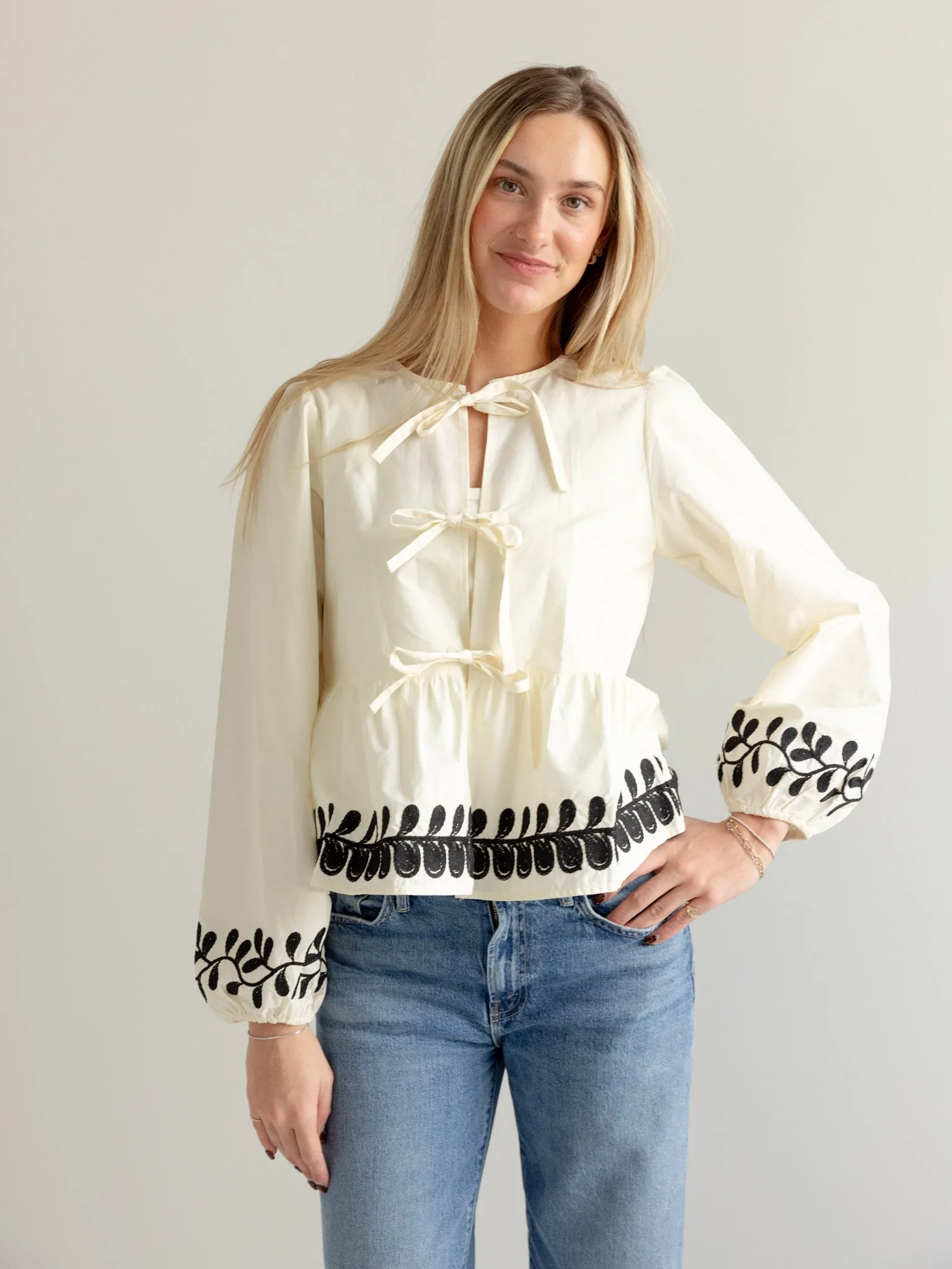 Anti Pill Finish Cozy Knit Embroidered Peplum Bow Blouse