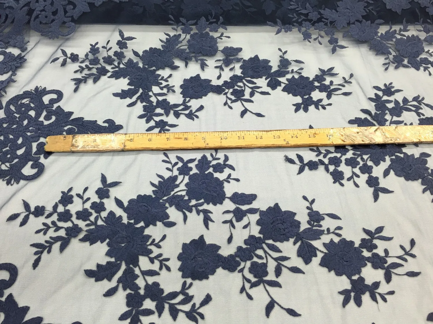 Navy blue flowers embroider on a 2 way stretch mesh lace. Wedding/Bridal/Prom/Nightgown fabric. Sold by the yard.